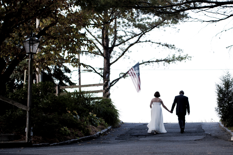 bride and groom walking away